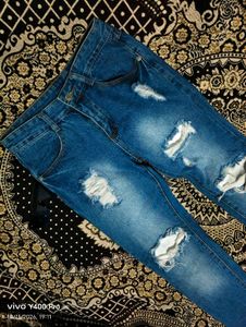 Distressed Blue Denim Jeans