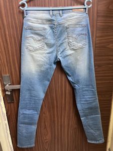 Distressed Light Wash Denim Jeans