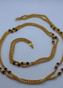 Elegant Gold Chain with Black Beads