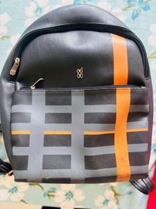 Stylish Black Backpack with Orange Accents