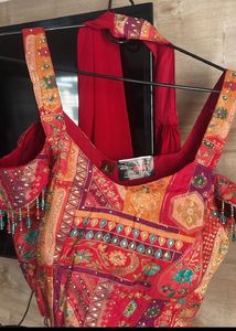 Red plazzo with stone work multi colour top