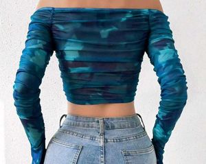 A blue off shoulder crop top