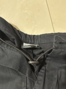 Black trendy parachute pants with adjustable lows