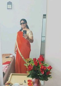Vibrant Orange Saree with Golden Border