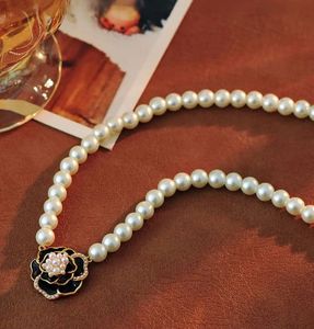 Elegant Pearl Necklace with Flower Pendant