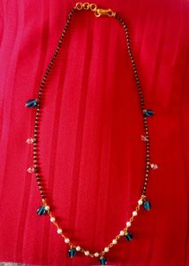 Elegant Black Bead Necklace with Blue Accents