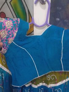 1) Royal Blue Lehenga Choli with Red Dupatta.  2)
