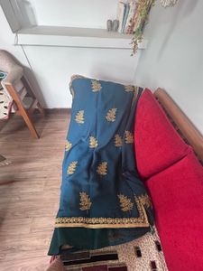 Elegant Teal Saree with Gold Embroidery
