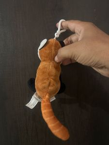 cute red panda plush keychain with a white