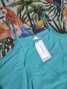 Chic Teal Top with Pom Po