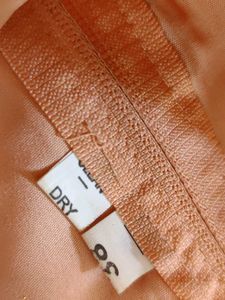 Ethnic peach gown with rich embroidery