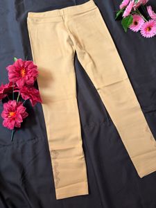Elegant Beige Leggings with Embroidered Hem