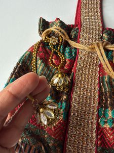 Luxury Brocade Potli Bag with Stone Jhumka Latkans