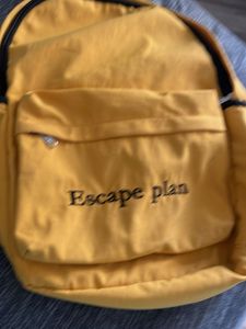 Yellow Backpack with "Escape plan" Text
