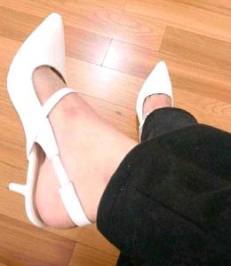 White Pointed Slingback Heels.