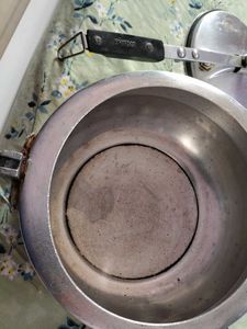 A silver pressure cooker