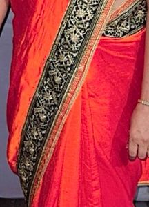 Elegant Orange Saree with Embellished Blouse