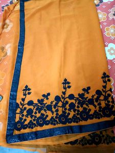 Vibrant Orange Saree with Floral Border