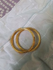Combo Of Two Golden Bangles, One Bracelet And Kada