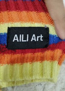 Rainbow Striped Cropped Turtleneck Sweater.