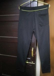 Stylish white Zudio top paired with black slim-fit