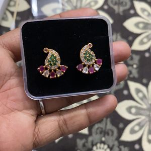 ad stone covering earrings