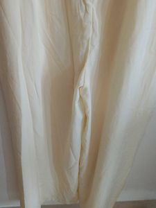 Cream Off-Shoulder Jumpsuit with Tie-Up Sleeves