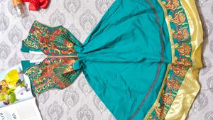 Elegant Teal Saree with Intricate Border