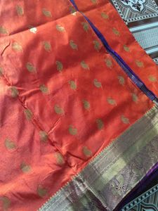 Elegant orange saree  with Gold Motifs