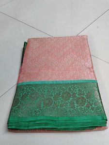 Elite orange green saree...