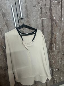 Elegant Cream Top with Black Trim