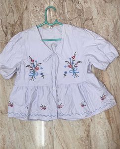 Embroidered light blue Peplum Top