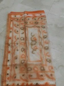 2 organza sarees one orange and another is pink on