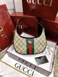 GUCCI* *GG MARMONT HALF-MOON-SHAPED MINI BAG*