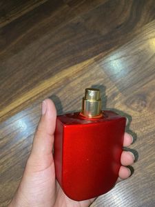 Unique Red Perfume Bottle with Ornate Cap