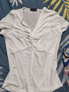 white top shimmery ish material