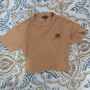 Tan crop top with rose Size M