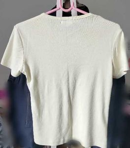Cream T-Shirt with Blue Flower Graphic