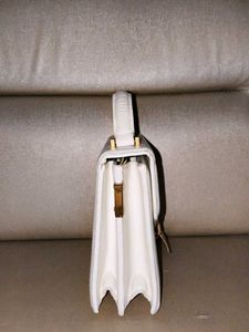 Classic White Structured Handbag with Gold Clasp
