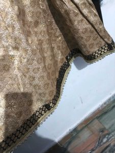 black kurti with golden lehga