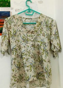 Soft beige color with floral and leaf printV-neck