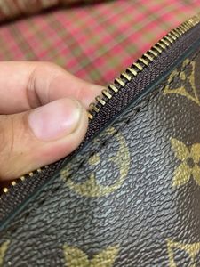 Louis Vuitton pouch Authenticity Not Verified