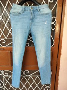 Light Wash Distressed Denim Jeans