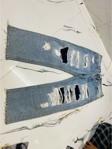 Distressed Blue Denim Jeans