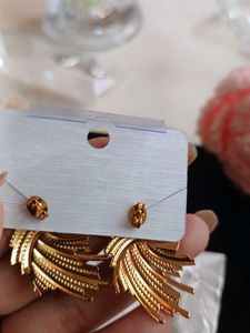 Unique Gold-Tone Swirl Stud Earrings