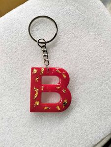 Red 'B' Letter Keychain with Gold Flakes