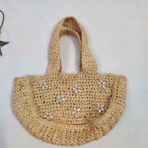 Straw tote bag with pearl embellishments