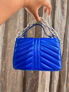 Blue sling purse