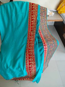 Elegant Teal Saree with Embroidered Border