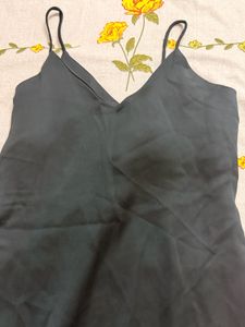 Elegant Black Dress with Floral Accent